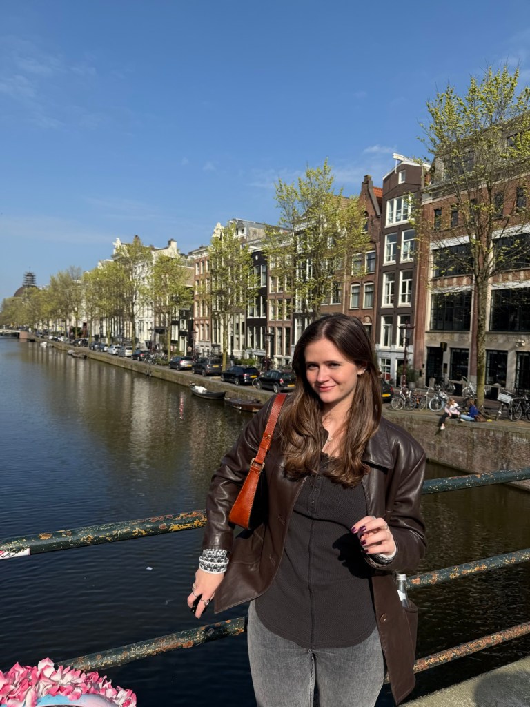 Standing on a bridge over a canal in Amsterdam, 2025. 