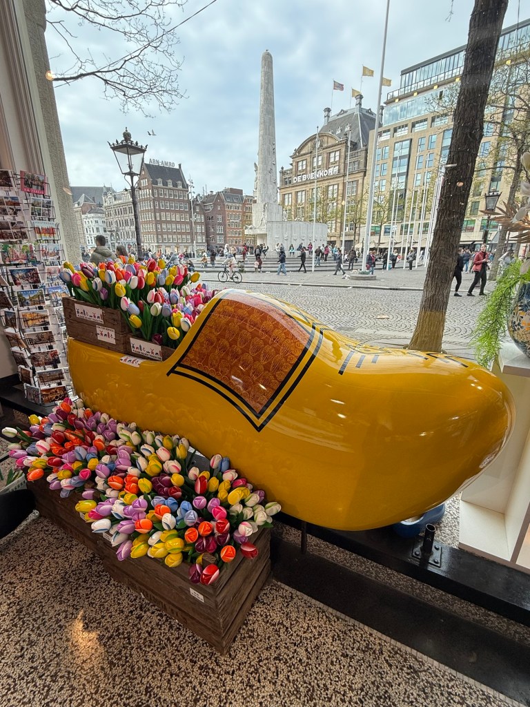 A clog filled with wooden tulips in a souvenir shop in Amsterdam. 