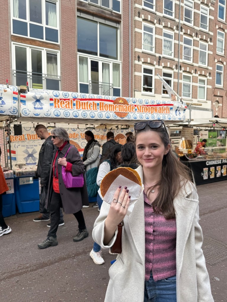 Buying a stroopwafel at the Albert Cuyp market in Amsterdam. 