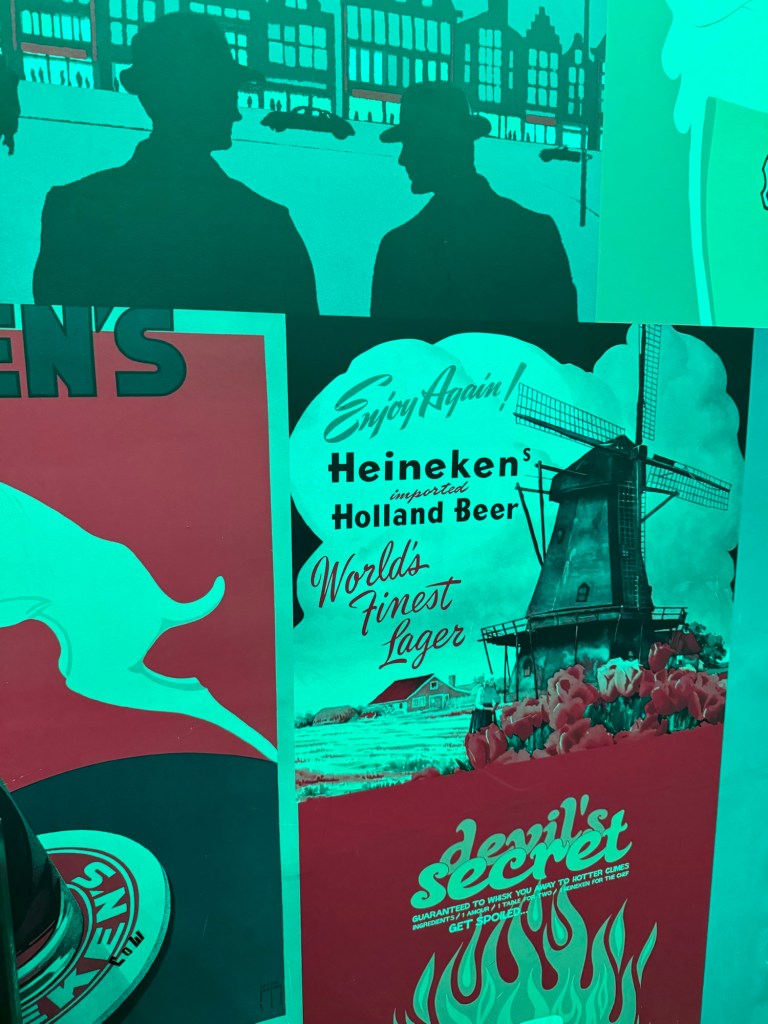 Old advertisements on the wall at The Best Dam Bar at the Heineken Experience in Amsterdam. 